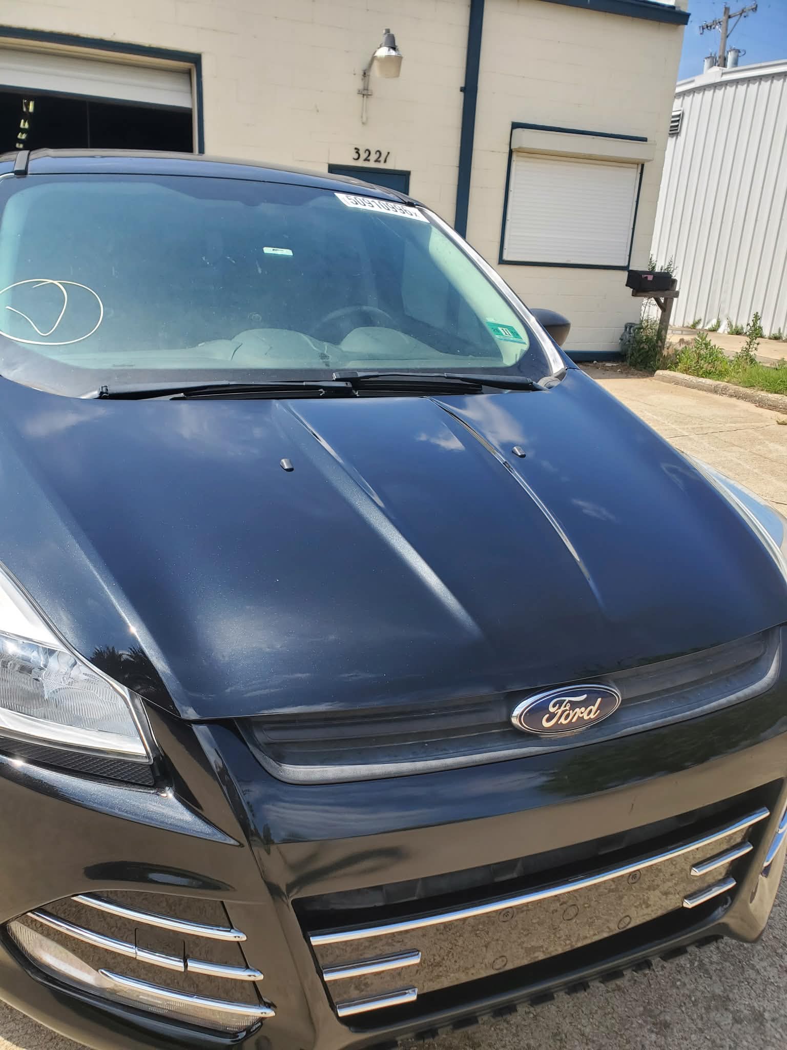 Black Ford hood after paint matching and blending