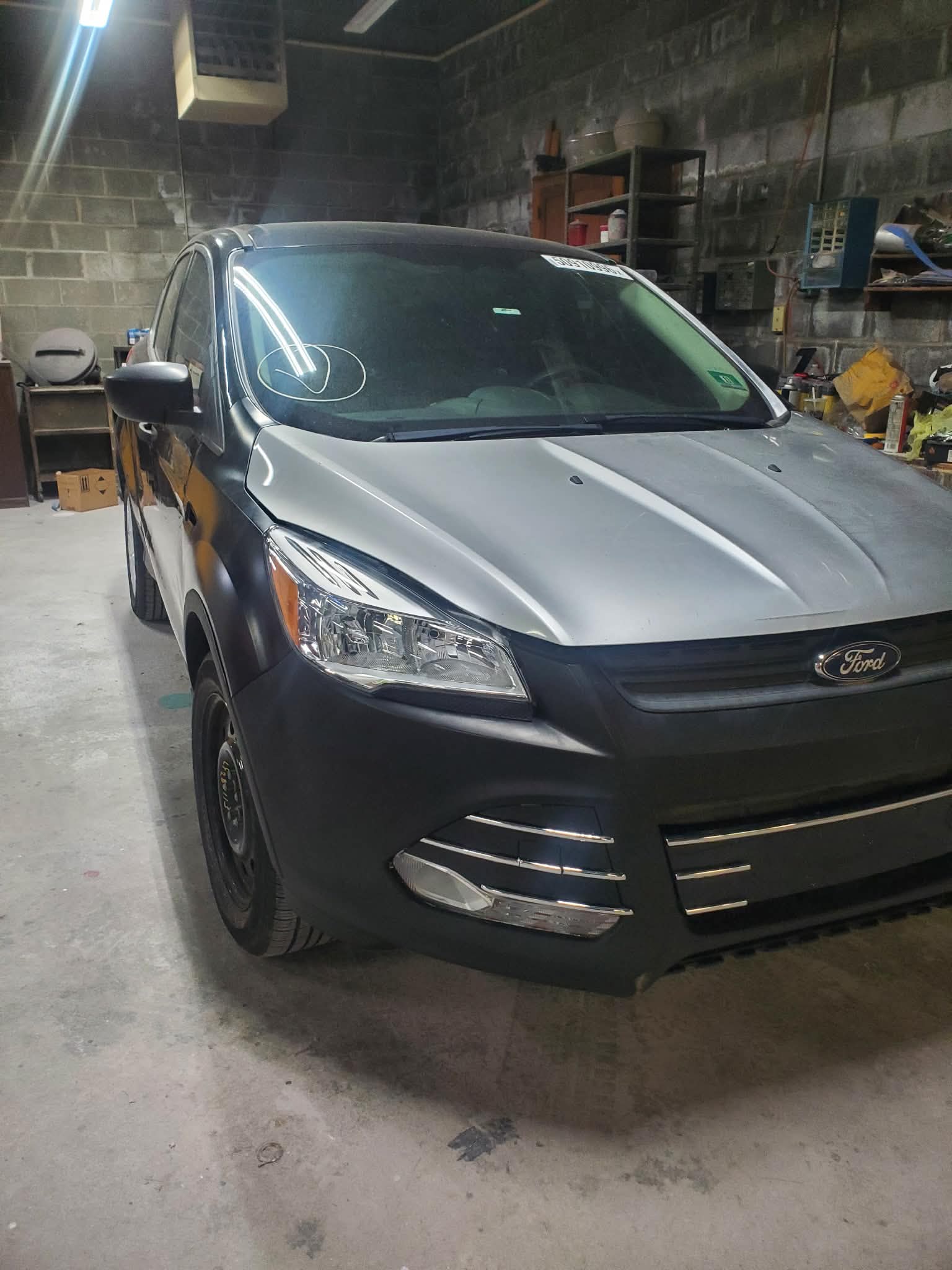 Black Ford hood before paint matching and blending