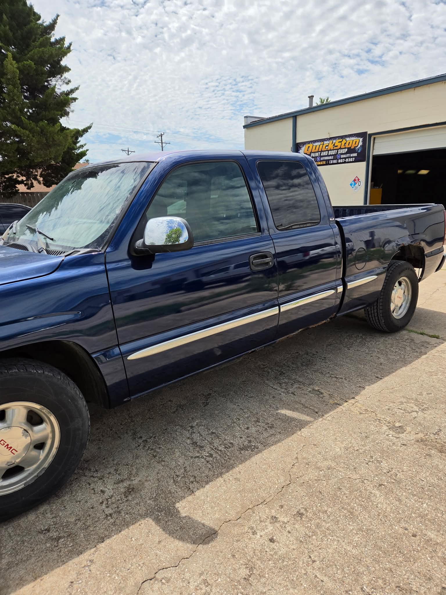 Blue GMC truck replacement doors after paint matching and blend